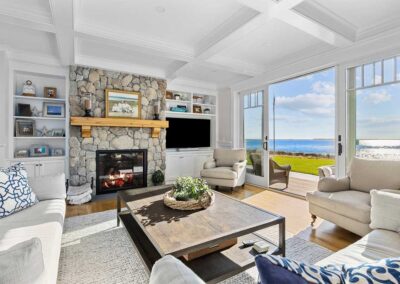 living room with stone fireplace