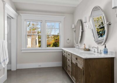 bathroom with two sinks in a wood vanity
