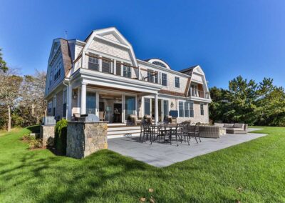 Outside living space with table and a grill