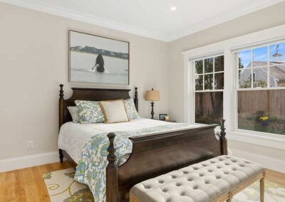 quaint bedroom with bench at the end of the bed