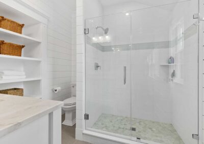 Walk in shower in small corner bathroom